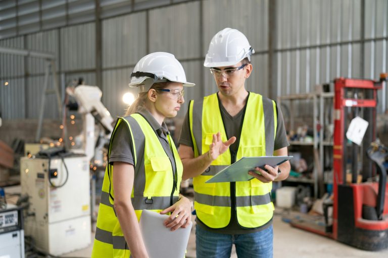 Business industry technology, people and tech. Engineer working maintenance in factory warehouse