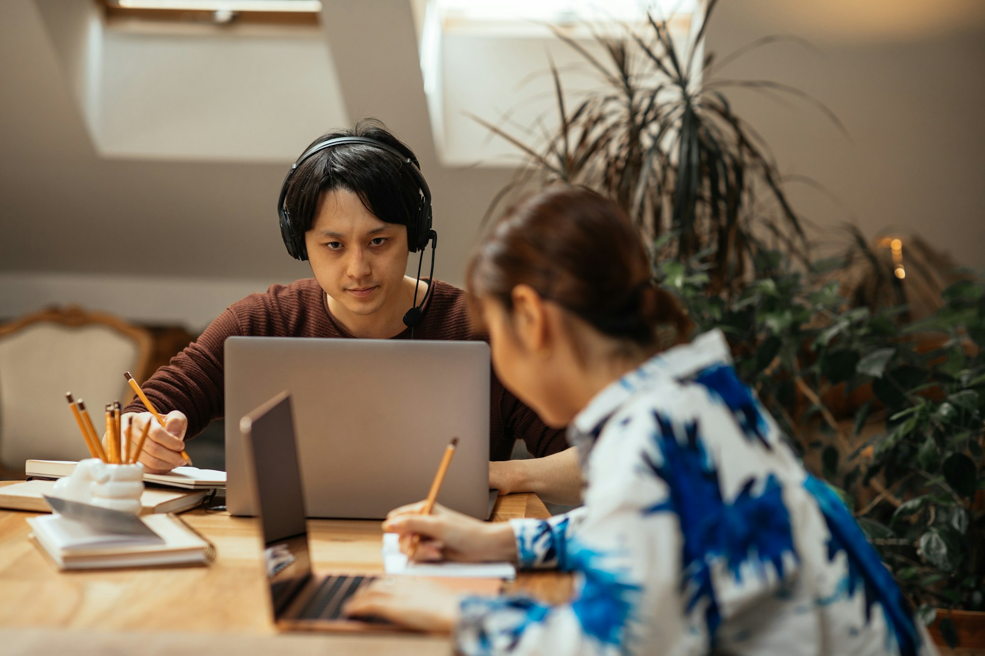 Japanese couple working at home via technology